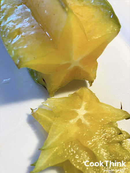 star fruit being sliced and stacked