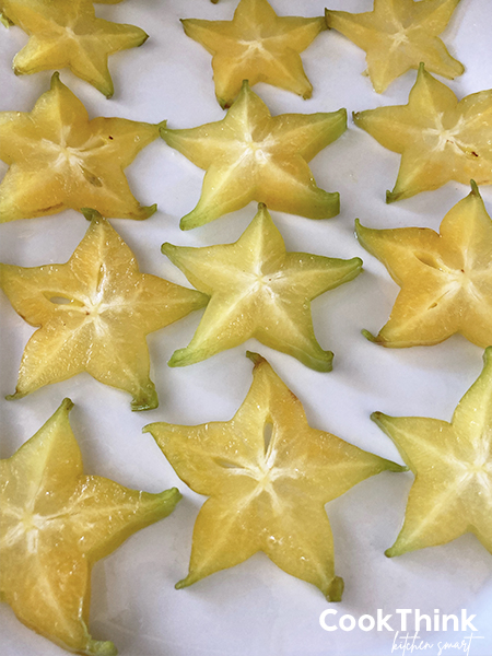 star fruit sliced on a white plate