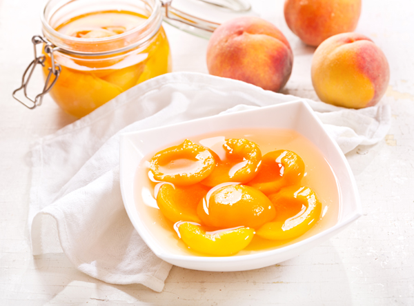 canned peaches in a bowl