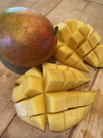 cut mango on cutting board