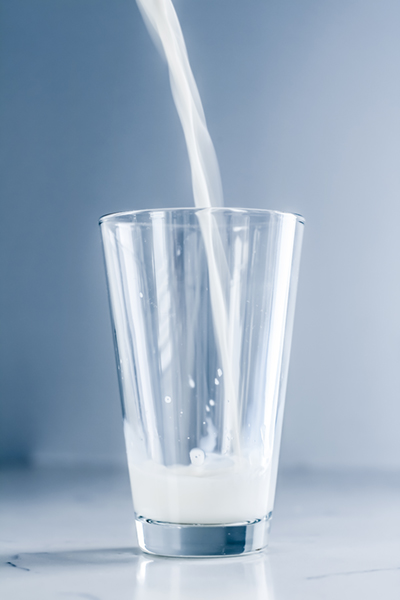 milk streaming into a glass
