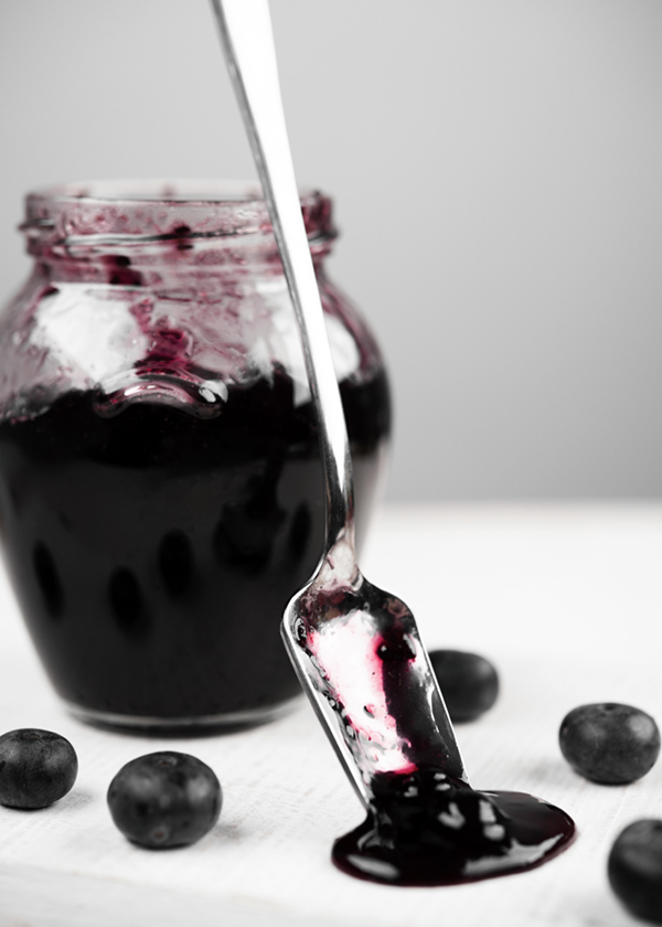 blueberry compote with spoon standing
