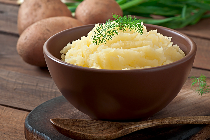 mashed potatoes in wood bowl