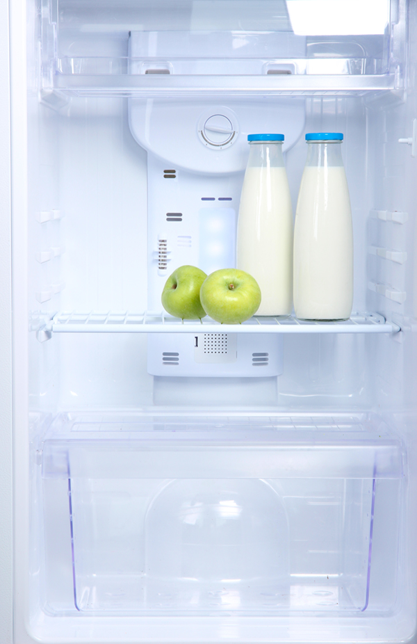 open refrigerator with milk inside