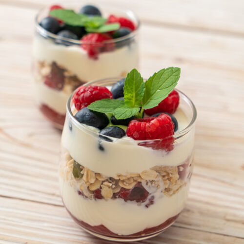 greek yogurt with berries in cups