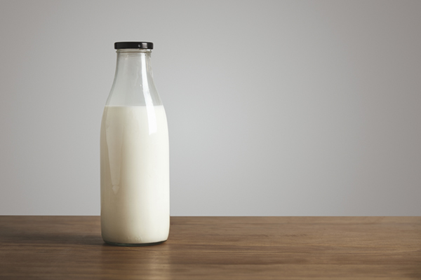 milk in a glass bottle with lid