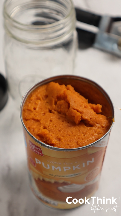 opened canned pumpkin with jar