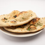 naan bread on a white plate