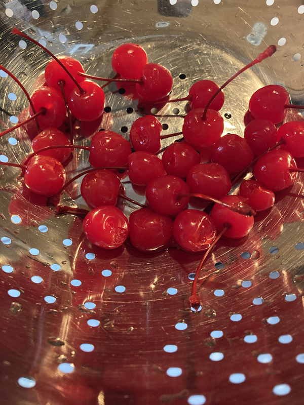 cherries in a strainer
