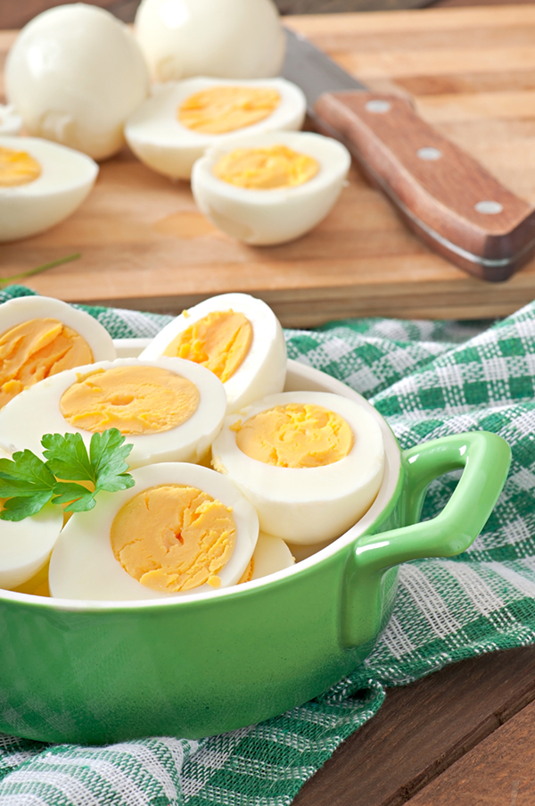 boiled eggs in a green bowl