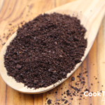 coffee grounds on a wooden spoon