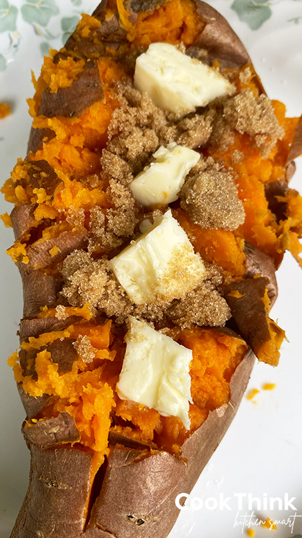 baked sweet potato topped with butter and brown sugar